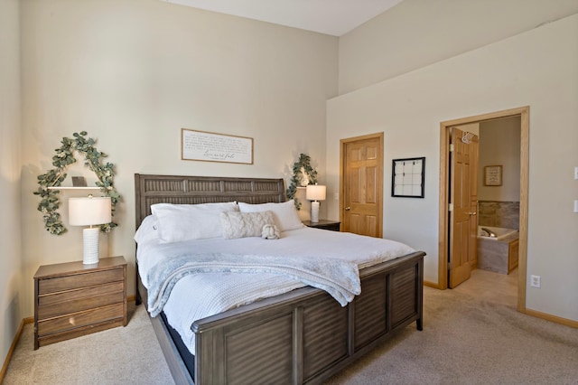 carpeted bedroom with connected bathroom