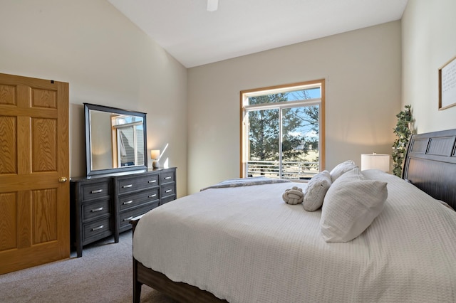 carpeted bedroom featuring vaulted ceiling and ceiling fan