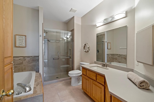 full bathroom with tile patterned floors, vanity, toilet, and separate shower and tub