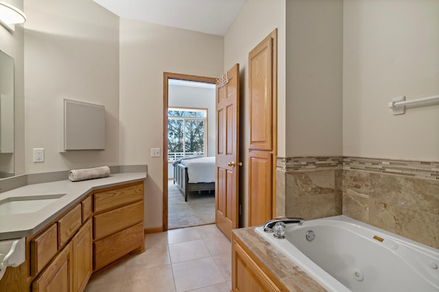 bathroom featuring vanity, a bath, and tile patterned floors