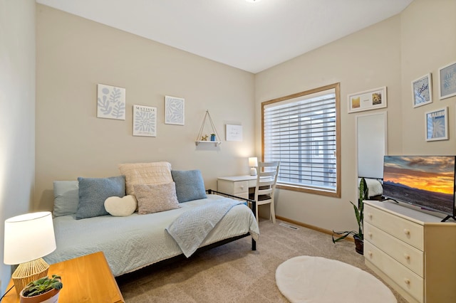 bedroom with light colored carpet