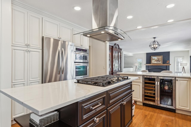 7720 Shaughnessy Rd, Edina, MN 55439 - kitchen featuring stainless steel appliances, island range hood, wine cooler, recessed lighting, and dark brown cabinetry