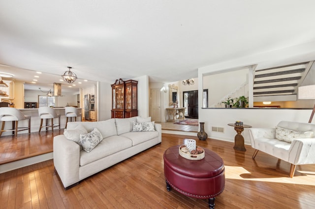 7720 Shaughnessy Rd, Edina, MN 55439 - living room featuring a chandelier and hardwood / wood-style flooring