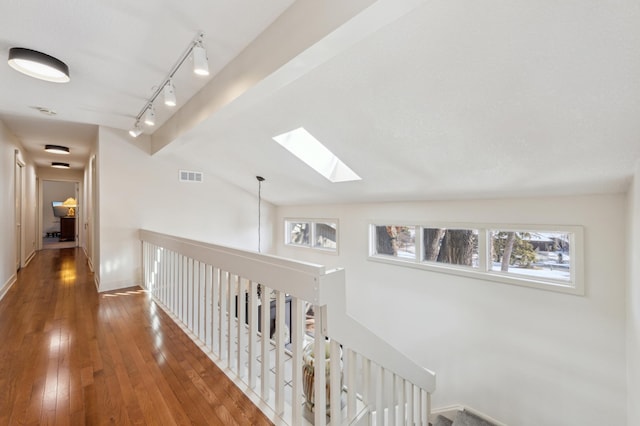 7720 Shaughnessy Rd, Edina, MN 55439 - corridor with a skylight, hardwood / wood-style floors, an upstairs landing, and vaulted ceiling