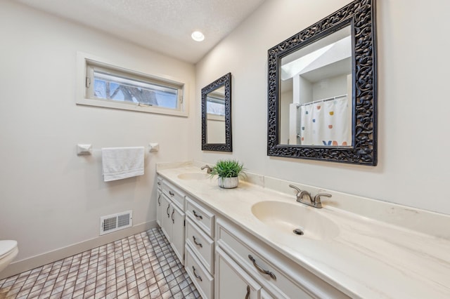 7720 Shaughnessy Rd, Edina, MN 55439 - full bathroom with double vanity and a textured ceiling