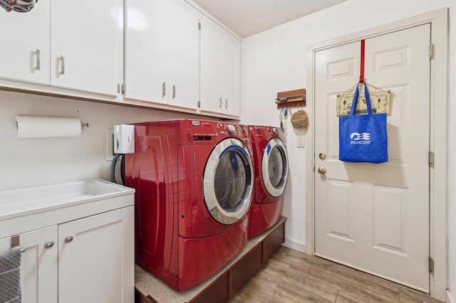 7720 Shaughnessy Rd, Edina, MN 55439 - washroom with cabinet space, separate washer and dryer, and light wood-type flooring