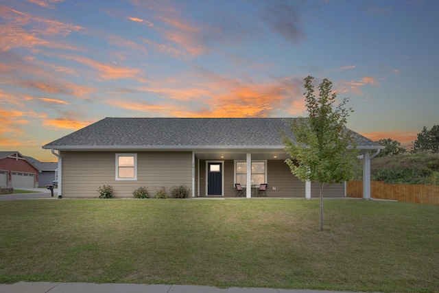 ranch-style house featuring a yard