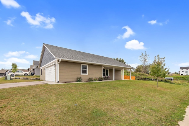 ranch-style home featuring a garage and a front yard