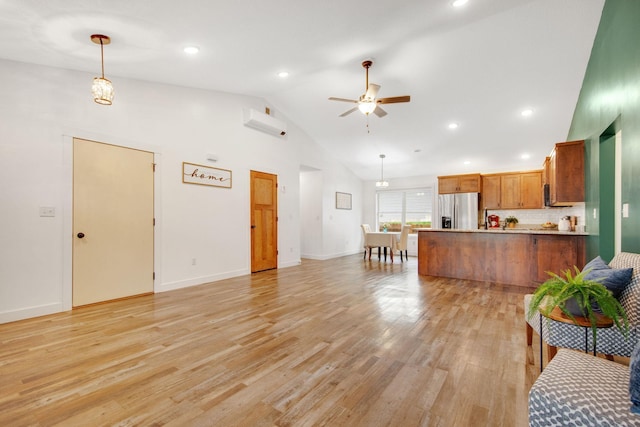 living room featuring ceiling fan, high vaulted ceiling, and light hardwood / wood-style flooring