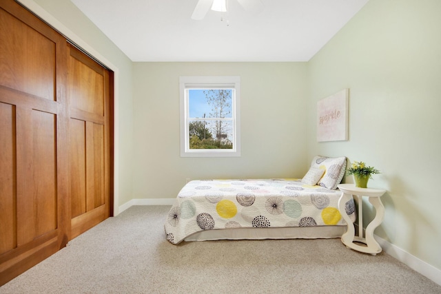 bedroom featuring ceiling fan and carpet