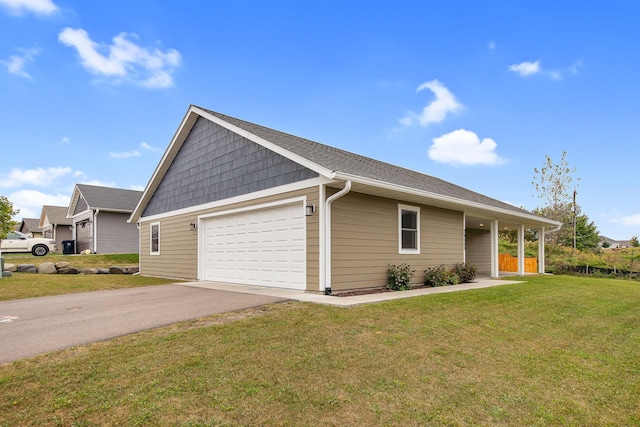 view of front of property featuring a garage and a front yard