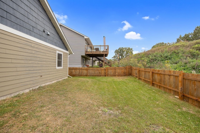 view of yard with a wooden deck