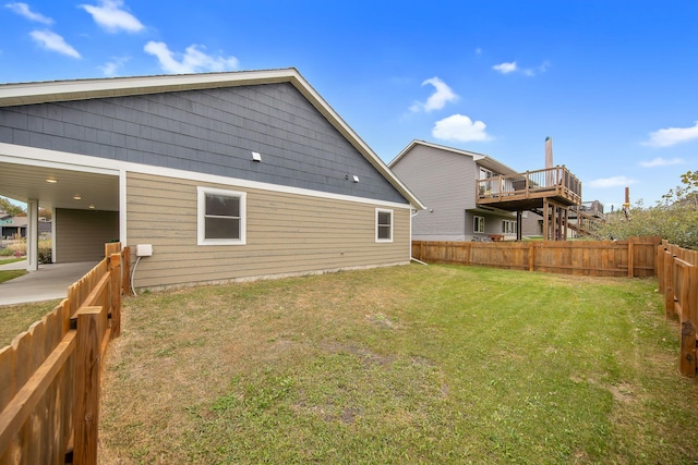 rear view of property featuring a lawn