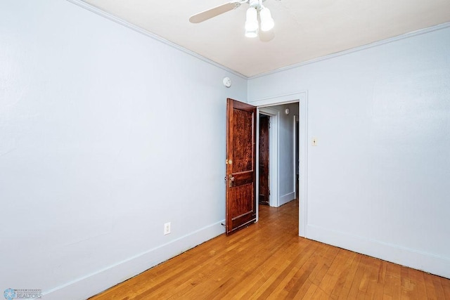 unfurnished room with ornamental molding, light hardwood / wood-style floors, and ceiling fan