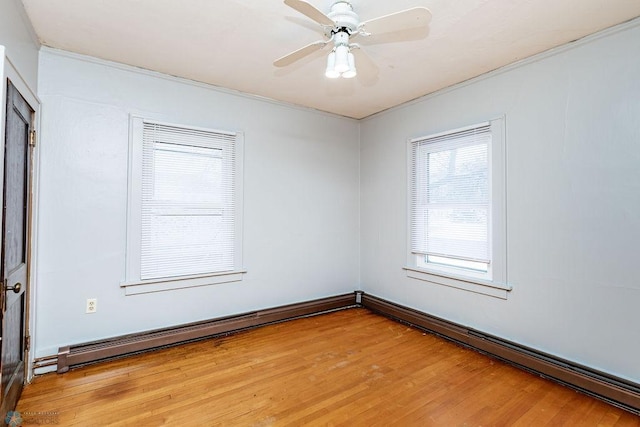 spare room featuring wood-type flooring and ceiling fan