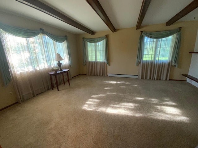 carpeted empty room featuring beamed ceiling and a baseboard radiator