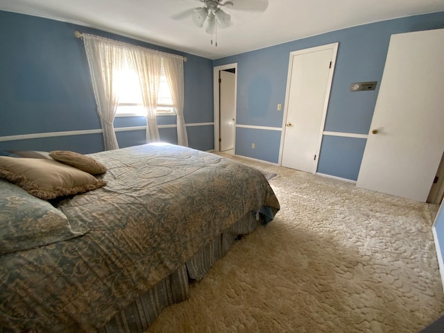 bedroom featuring ceiling fan and carpet flooring