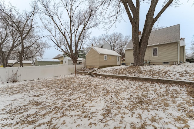 view of yard layered in snow