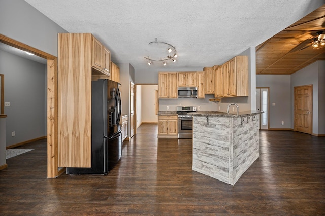 kitchen with light brown cabinetry, dark wood-type flooring, a breakfast bar, and appliances with stainless steel finishes