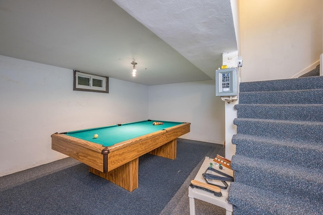 rec room featuring dark carpet, billiards, and a textured ceiling