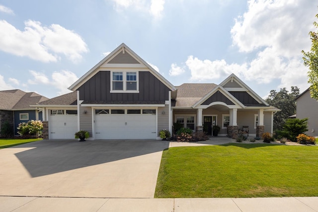 craftsman-style house featuring a porch, a garage, and a front lawn