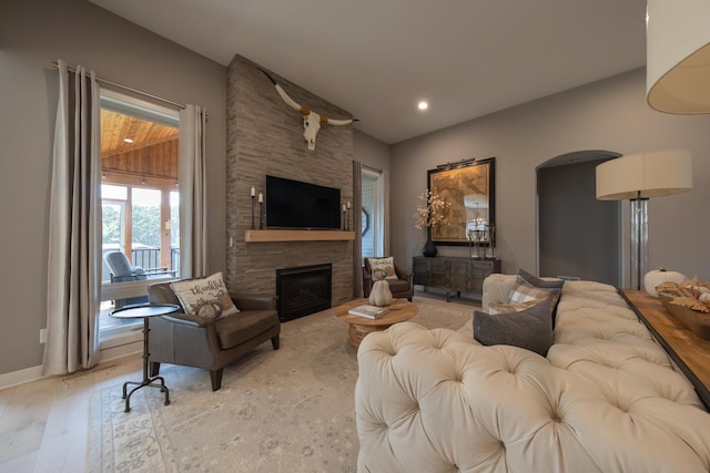 living room with a fireplace and light hardwood / wood-style floors