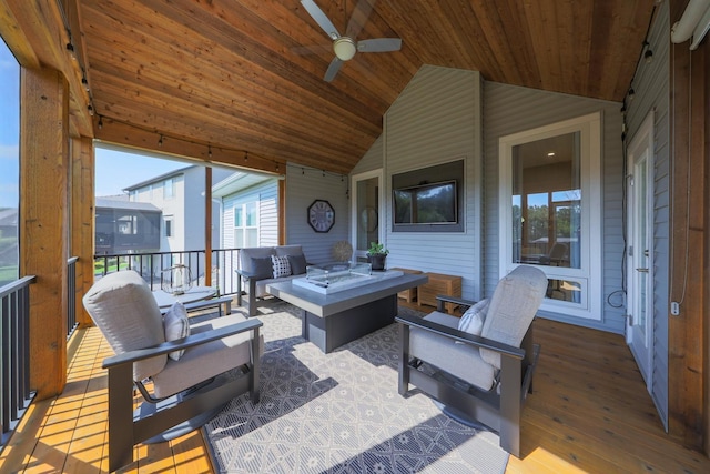 sunroom featuring lofted ceiling, a wealth of natural light, and wood ceiling