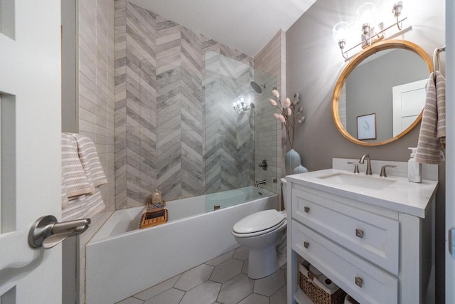 full bathroom with vanity, tiled shower / bath, tile patterned floors, and toilet