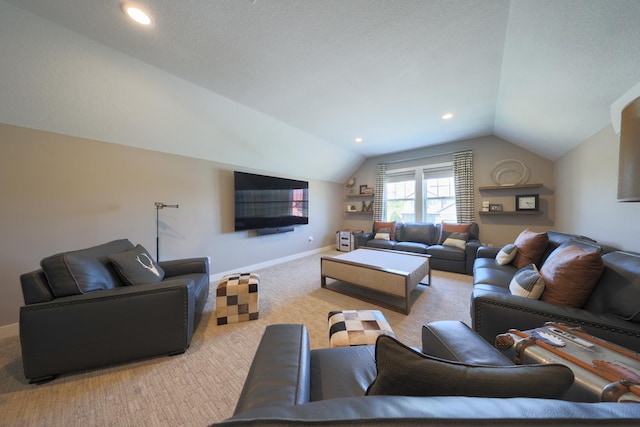 carpeted living room featuring vaulted ceiling and a textured ceiling