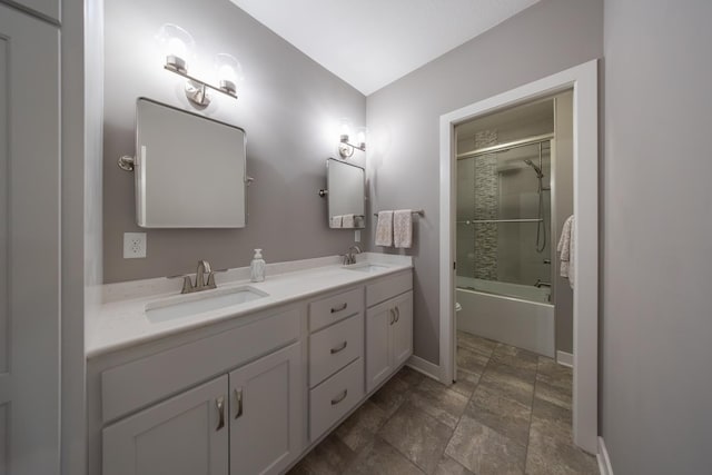 full bathroom featuring vanity, enclosed tub / shower combo, and toilet