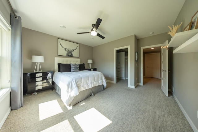 carpeted bedroom featuring a closet and ceiling fan