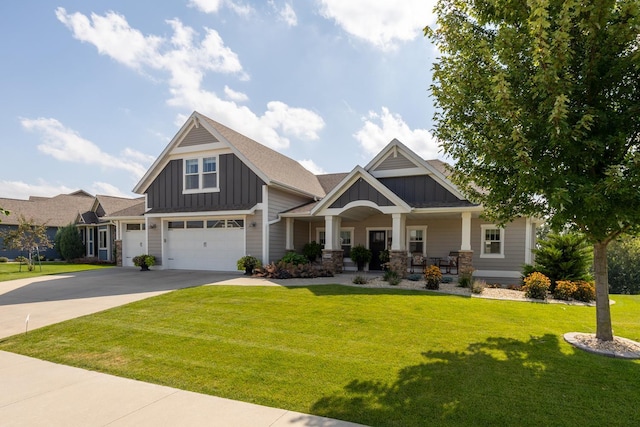 craftsman-style house featuring a garage, a front lawn, and a porch