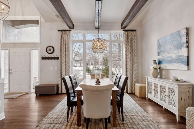 dining space featuring a notable chandelier, beam ceiling, and dark wood-type flooring