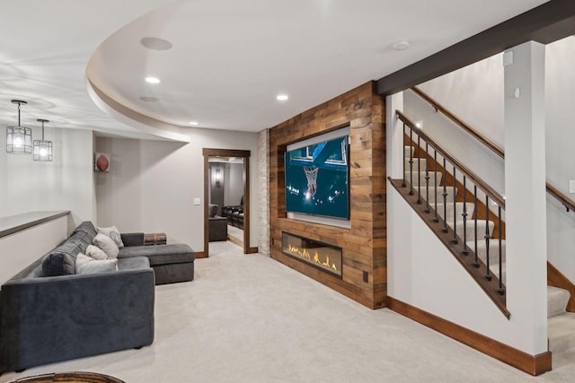 living room featuring carpet flooring, a large fireplace, stairs, recessed lighting, and baseboards