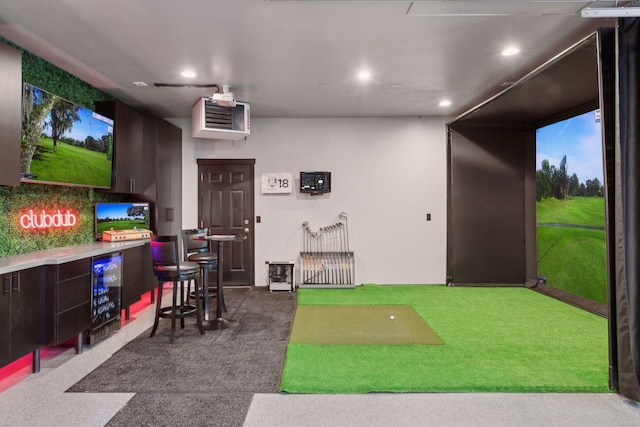 playroom featuring carpet floors, recessed lighting, beverage cooler, and golf simulator