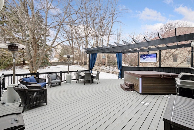 deck with a hot tub, a pergola, and outdoor dining space