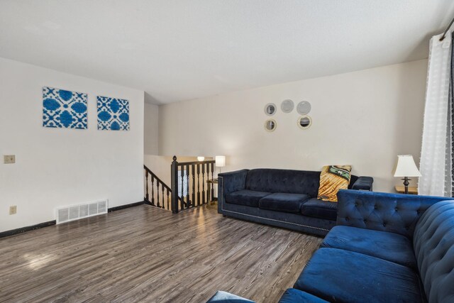 living room featuring dark wood-type flooring