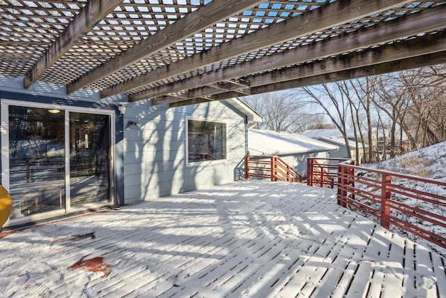 snow covered deck featuring a pergola