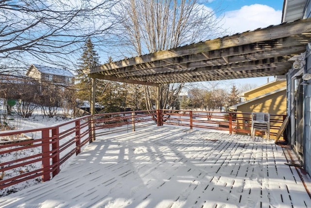 snow covered deck with a pergola