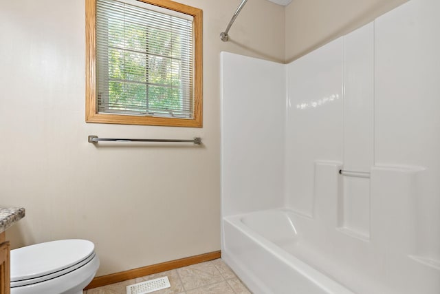 full bathroom featuring vanity, shower / bathing tub combination, tile patterned floors, and toilet