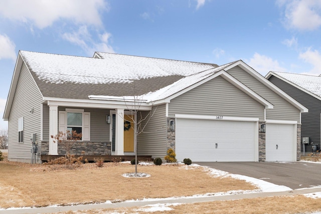 view of front of house with a garage and covered porch