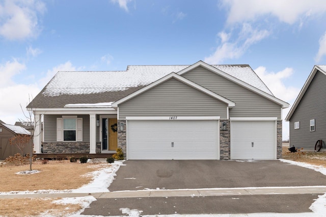 view of front of home featuring a garage and a porch