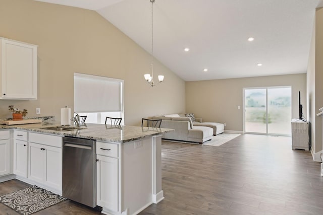 kitchen featuring pendant lighting, dishwasher, sink, and white cabinets