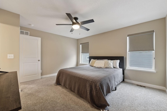 bedroom with light carpet and ceiling fan