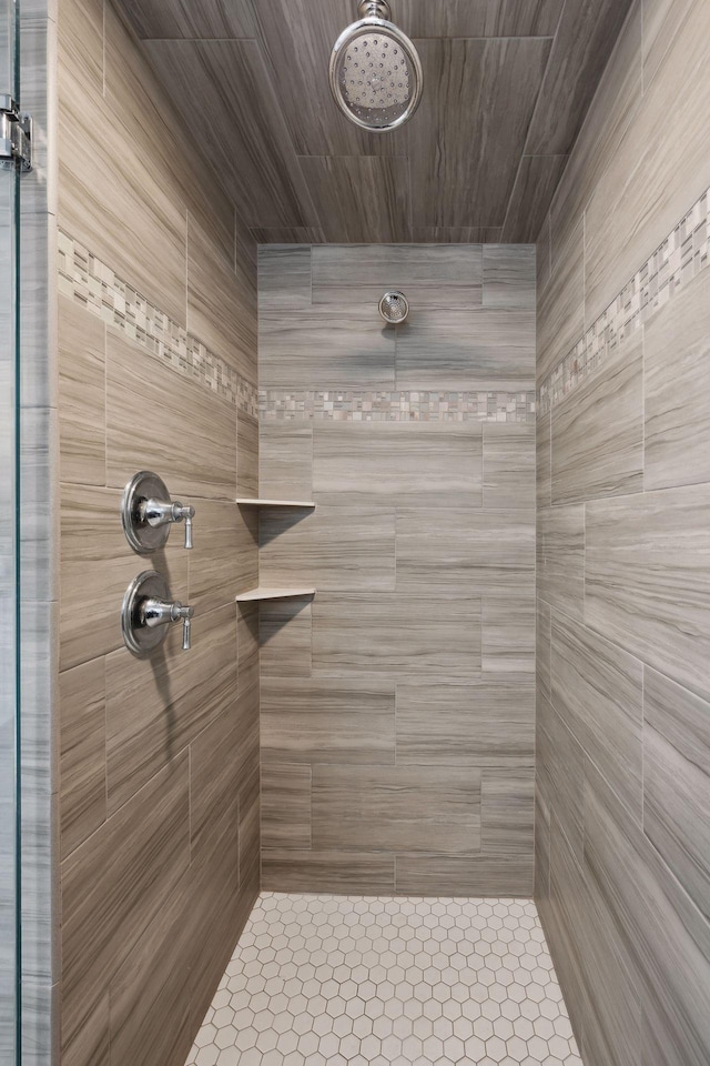 bathroom with a tile shower