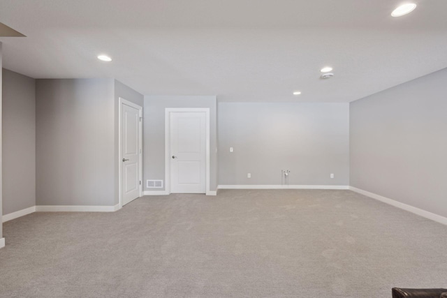 below grade area featuring recessed lighting, visible vents, carpet flooring, and baseboards