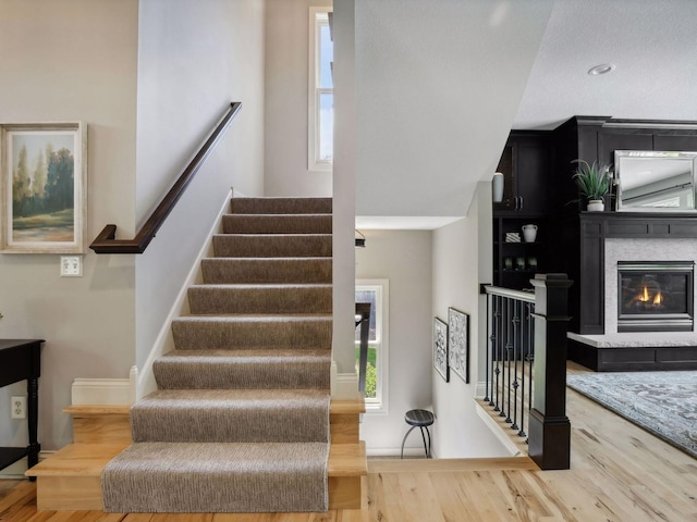 stairs featuring wood finished floors