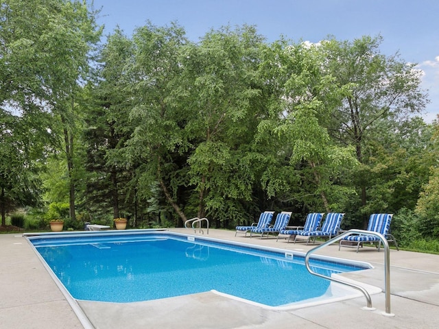 outdoor pool featuring a patio