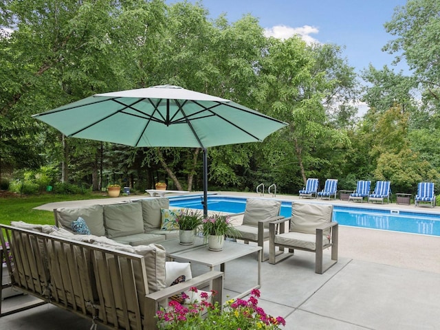 outdoor pool featuring an outdoor living space and a patio area