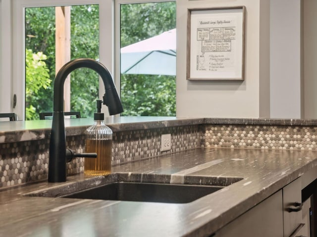 details with a sink and stainless steel counters